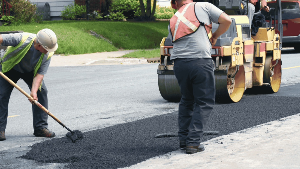 Professional paving contractor working on a driveway in Texas