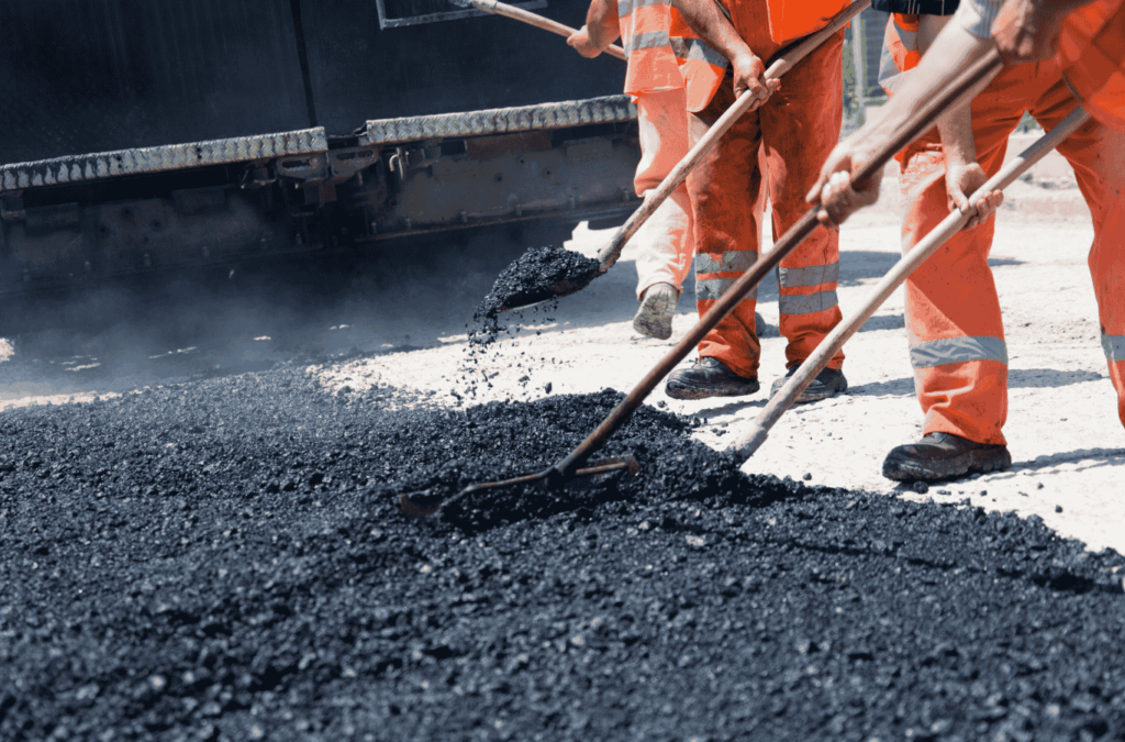 Professional paving contractor working on a driveway in Texas